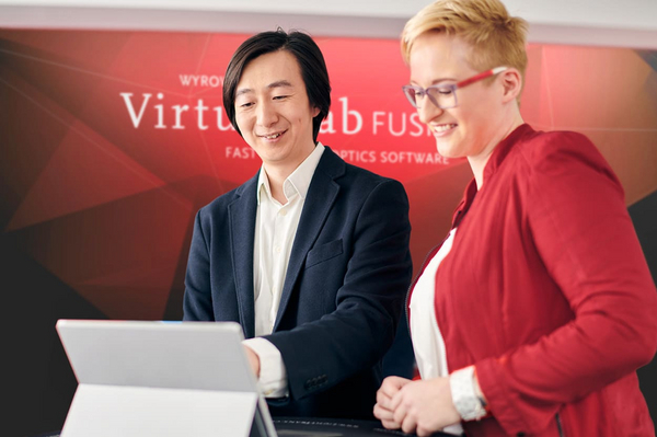 Employees talking about our product during an event at our exhibition booth.